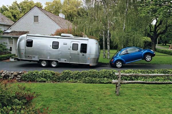 small blue car unable to tow caravan