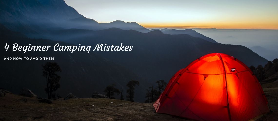 orange tent overlooking mountains at sunrise