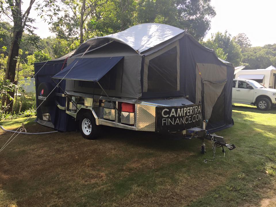 Camper trailer set up at a campsite
