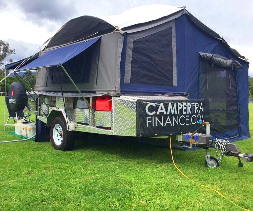 Camper trailer set up at a camp site. 